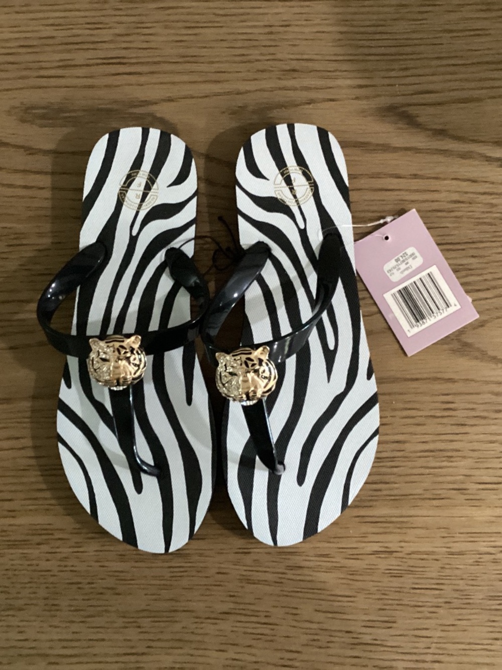 Cute tiger flip flops, new with tags, size 9